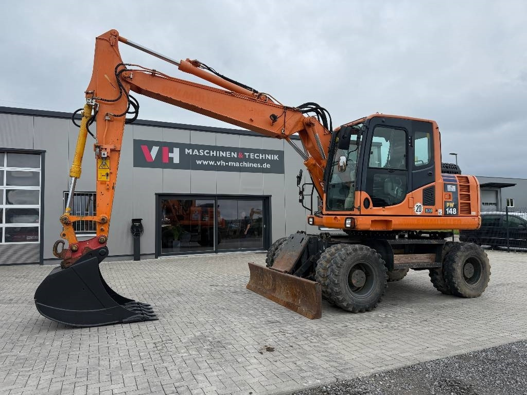 Komatsu PW 148-8 - حفارة دولاب: صورة 1 Komatsu PW 148-8 - حفارة دولاب: صورة 1