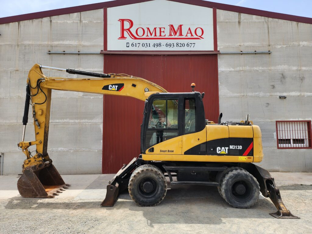 CAT M313D - حفارة دولاب: صورة 1 CAT M313D - حفارة دولاب: صورة 1