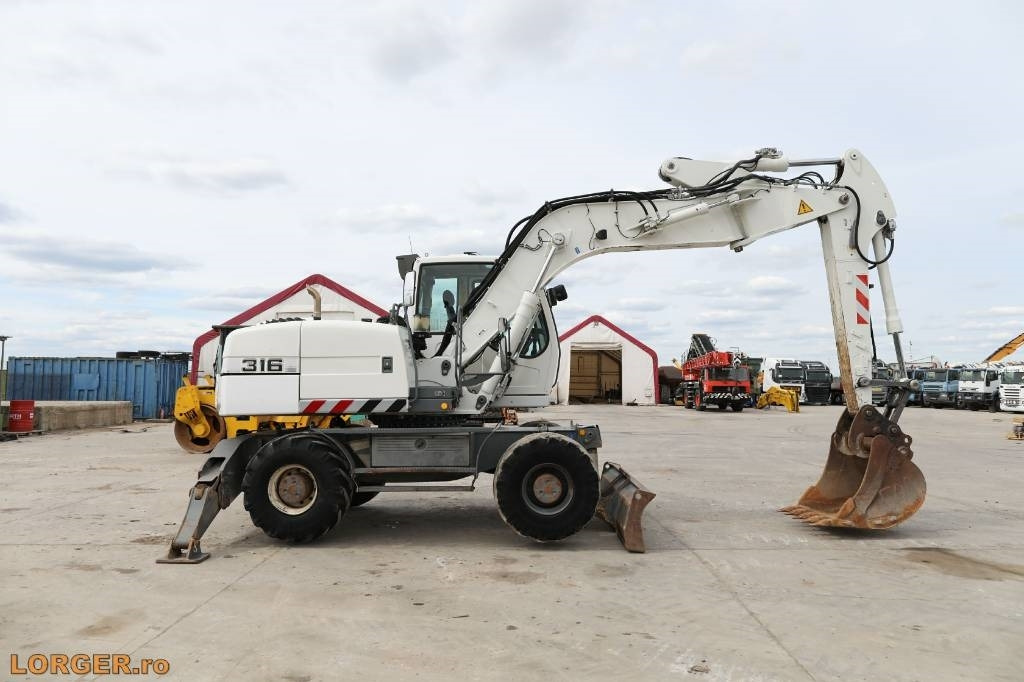 Liebherr A 316 Litronic - حفارة دولاب: صورة 1 Liebherr A 316 Litronic - حفارة دولاب: صورة 1