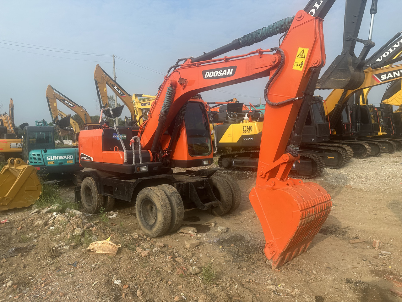 Doosan DX150W-9C - حفارة دولاب: صورة 2 Doosan DX150W-9C - حفارة دولاب: صورة 2