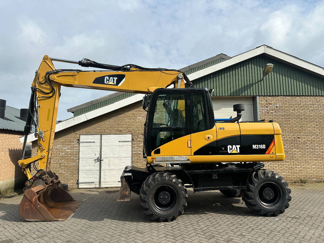 Caterpillar M316D - حفارة دولاب: صورة 1 Caterpillar M316D - حفارة دولاب: صورة 1