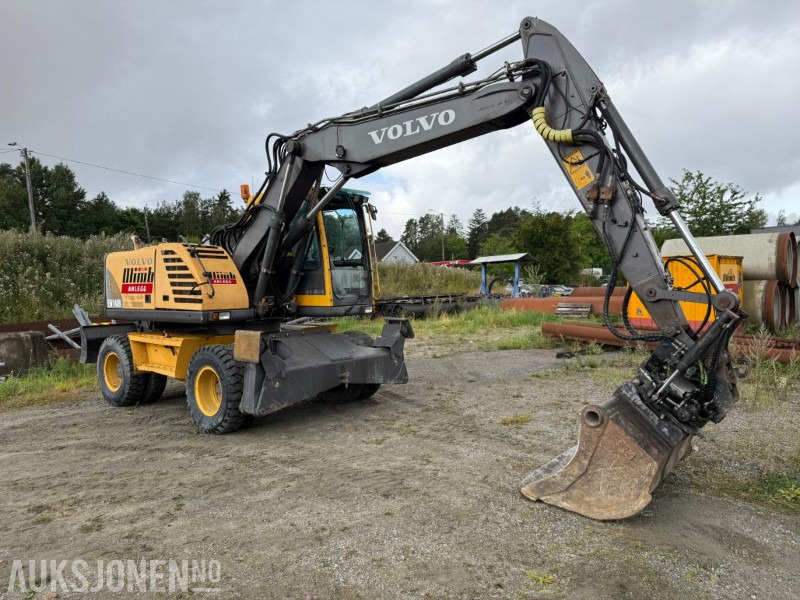 2006 Volvo EW140B Hjulgraver m/pallegaffel og skuff - Steelwrist tiltrotator. - حفارة: صورة 2 2006 Volvo EW140B Hjulgraver m/pallegaffel og skuff - Steelwrist tiltrotator. - حفارة: صورة 2