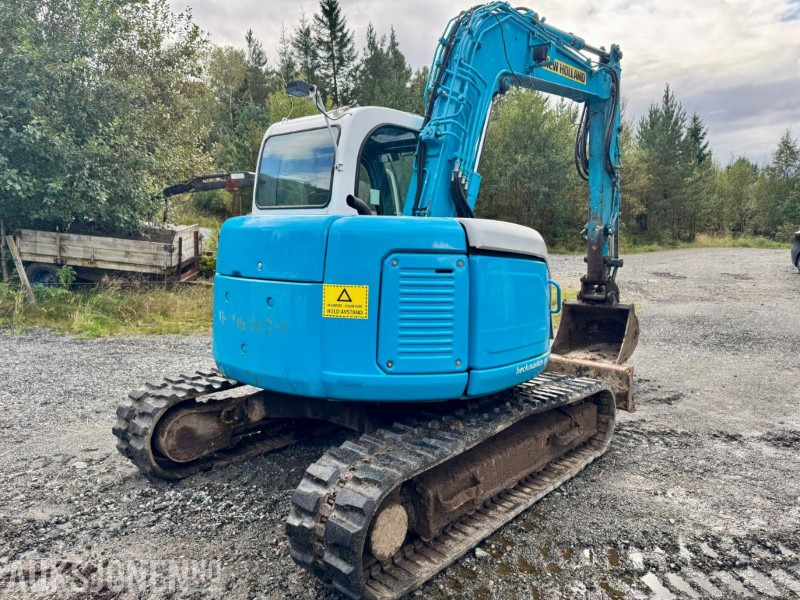 2008 New Holland E70SR-ES Gravemaskin - Tannskuffe - Grøfteskuffe - Pusseskuffe - Timer: 5746 - حفارة مُصَّغرة: صورة 4 2008 New Holland E70SR-ES Gravemaskin - Tannskuffe - Grøfteskuffe - Pusseskuffe - Timer: 5746 - حفارة مُصَّغرة: صورة 4