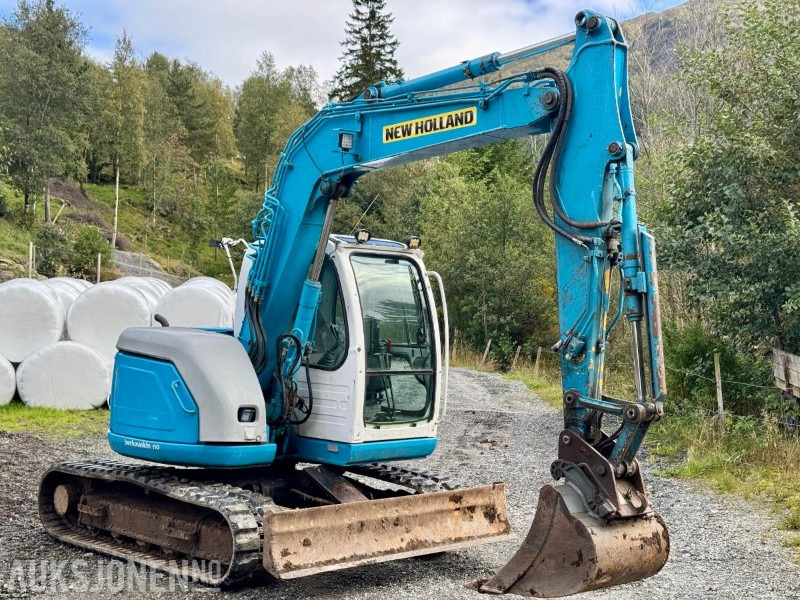 2008 New Holland E70SR-ES Gravemaskin - Tannskuffe - Grøfteskuffe - Pusseskuffe - Timer: 5746 - حفارة مُصَّغرة: صورة 2 2008 New Holland E70SR-ES Gravemaskin - Tannskuffe - Grøfteskuffe - Pusseskuffe - Timer: 5746 - حفارة مُصَّغرة: صورة 2
