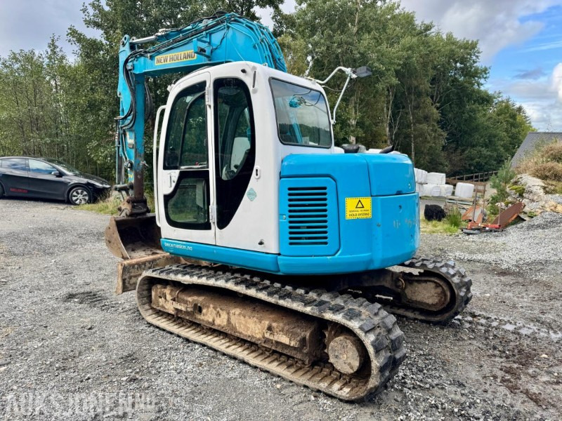 2008 New Holland E70SR-ES Gravemaskin - Tannskuffe - Grøfteskuffe - Pusseskuffe - Timer: 5746 - حفارة مُصَّغرة: صورة 3 2008 New Holland E70SR-ES Gravemaskin - Tannskuffe - Grøfteskuffe - Pusseskuffe - Timer: 5746 - حفارة مُصَّغرة: صورة 3