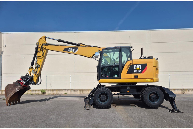 Caterpillar M315F - حفارة دولاب: صورة 1 Caterpillar M315F - حفارة دولاب: صورة 1
