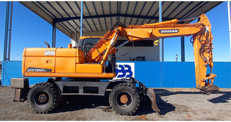 Doosan DX140W-3 - حفارة دولاب: صورة 2 Doosan DX140W-3 - حفارة دولاب: صورة 2