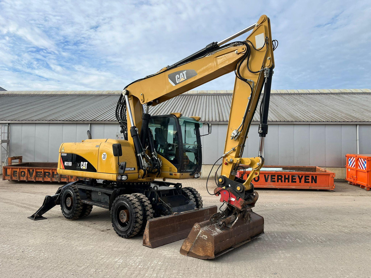 Caterpillar M318D - حفارة دولاب: صورة 1 Caterpillar M318D - حفارة دولاب: صورة 1