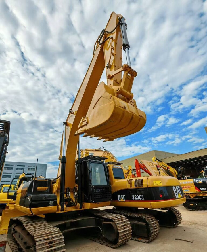 Caterpillar 320CL - حفارة دولاب: صورة 1 Caterpillar 320CL - حفارة دولاب: صورة 1