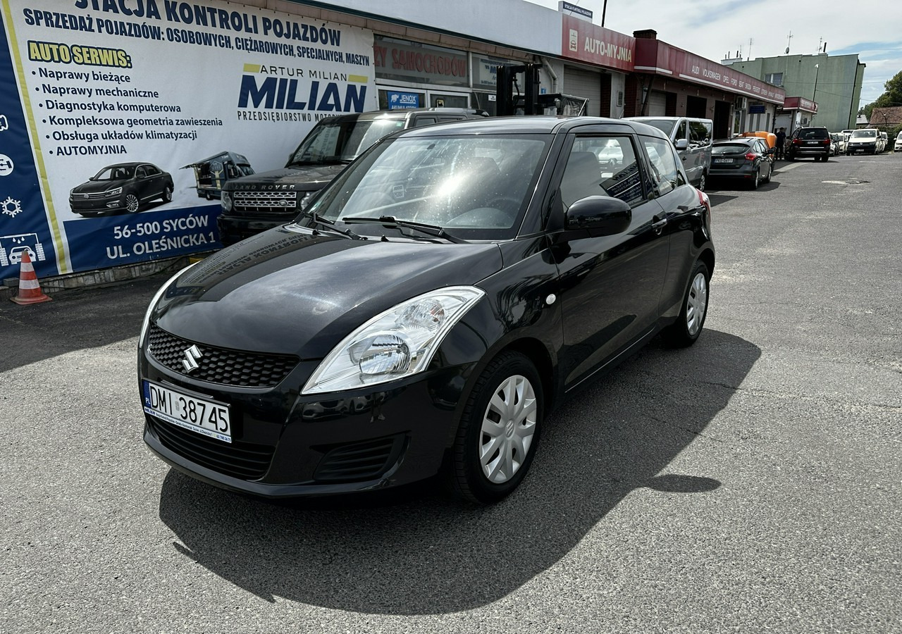 Suzuki Swift V Suzuki Swift 1.2-94KM Klima Model 2012 - هاتشباك: صورة 2 Suzuki Swift V Suzuki Swift 1.2-94KM Klima Model 2012 - هاتشباك: صورة 2