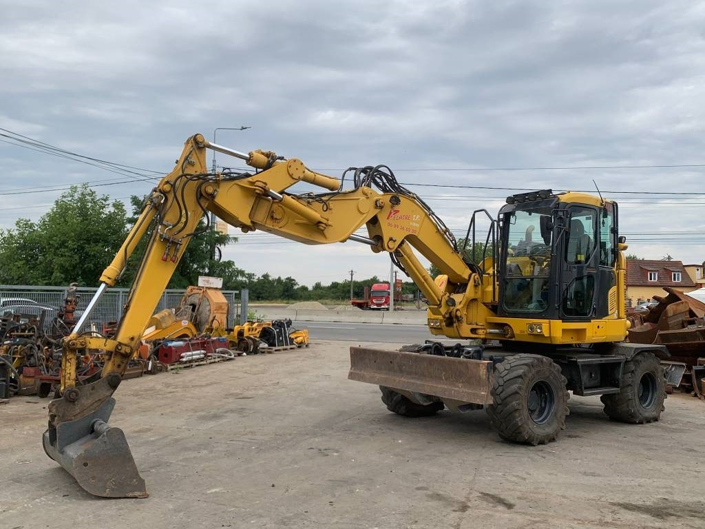 Komatsu PW118MR-11W - حفارة دولاب: صورة 1 Komatsu PW118MR-11W - حفارة دولاب: صورة 1