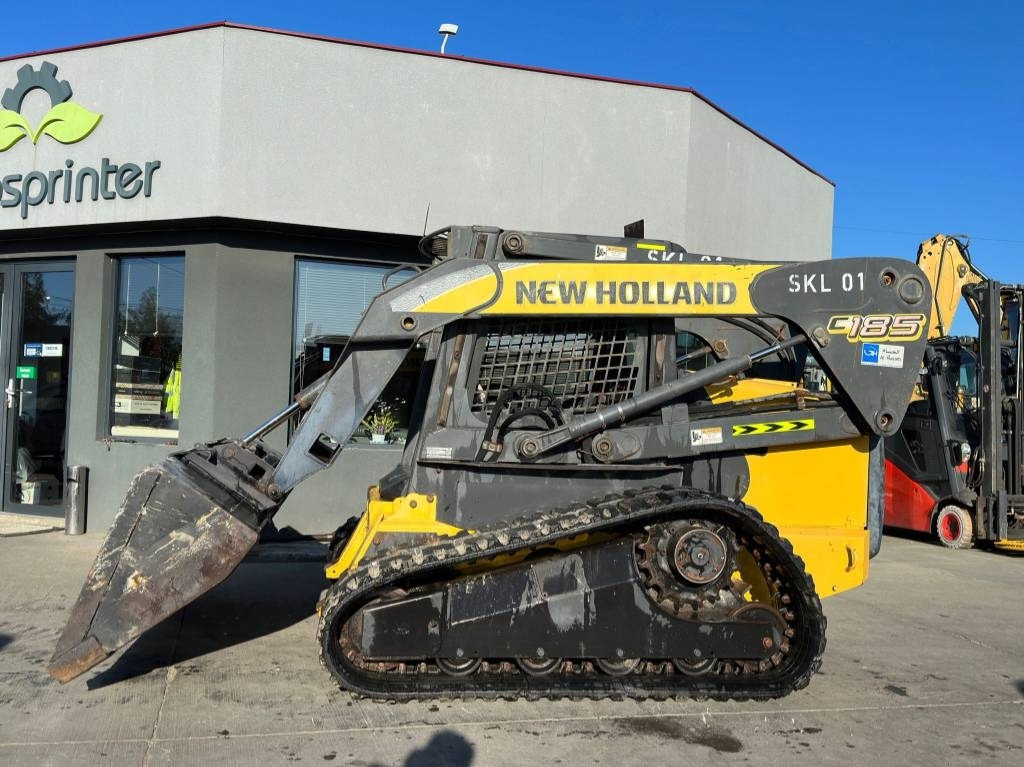 New Holland C 185 - اللودر المجنزر صغير: صورة 2 New Holland C 185 - اللودر المجنزر صغير: صورة 2