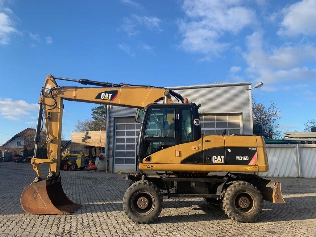 CAT M 316 D - حفارة دولاب: صورة 2 CAT M 316 D - حفارة دولاب: صورة 2