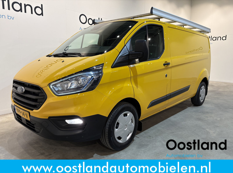 Ford Transit Custom 320 2.0 TDCI L2H1 Trend / Euro 6 / Airco / Cruise Control / PDC / Trekhaak / Imperiaal - فان المدمجة: صورة 1 Ford Transit Custom 320 2.0 TDCI L2H1 Trend / Euro 6 / Airco / Cruise Control / PDC / Trekhaak / Imperiaal - فان المدمجة: صورة 1