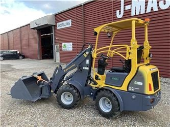 Eurotrac W11 med lang arm, skovl og gafler - لودر مفصلي صغير: صورة 1 Eurotrac W11 med lang arm, skovl og gafler - لودر مفصلي صغير: صورة 1