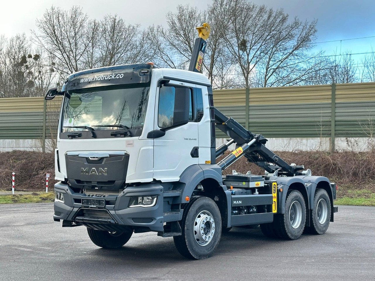 MAN TGS 33.440 6x4 Euro6e Abrollkipper Hyva - شاحنة ذات خطاف, شاحنة كرين: صورة 1 MAN TGS 33.440 6x4 Euro6e Abrollkipper Hyva - شاحنة ذات خطاف, شاحنة كرين: صورة 1