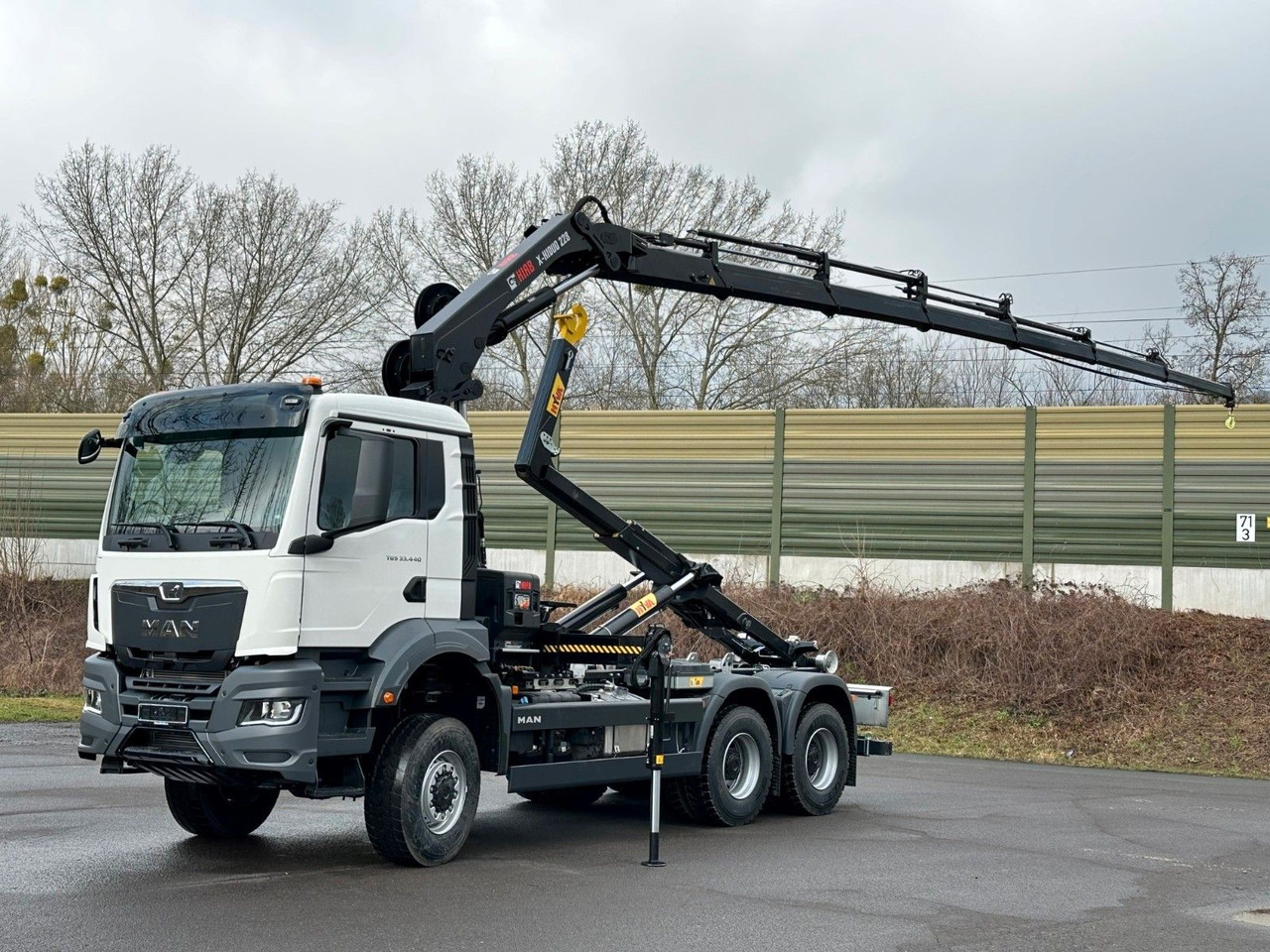 MAN TGS 33.440 6x6 BB Abrollkipper+Kran Hiab 228-6 - شاحنة ذات خطاف, شاحنة كرين: صورة 1 MAN TGS 33.440 6x6 BB Abrollkipper+Kran Hiab 228-6 - شاحنة ذات خطاف, شاحنة كرين: صورة 1