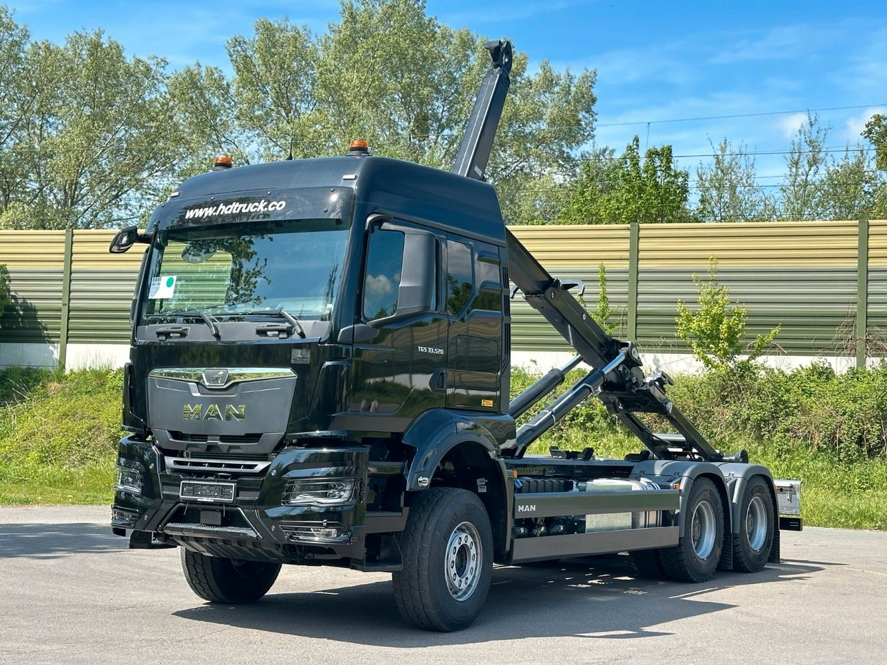 MAN TGS 33.520 6X4 Euro6e Abrollkipper MULTILIFT - شاحنة ذات خطاف, شاحنة كرين: صورة 1 MAN TGS 33.520 6X4 Euro6e Abrollkipper MULTILIFT - شاحنة ذات خطاف, شاحنة كرين: صورة 1