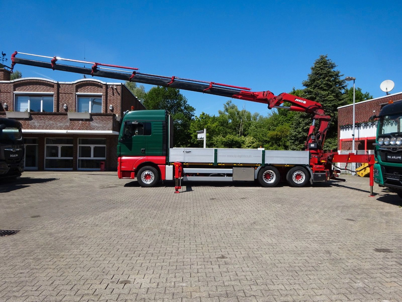 MAN 26.480 TGX + MKG HLK531 Kran +Lift-Lenkachse - شاحنات مسطحة, شاحنة كرين: صورة 1 MAN 26.480 TGX + MKG HLK531 Kran +Lift-Lenkachse - شاحنات مسطحة, شاحنة كرين: صورة 1