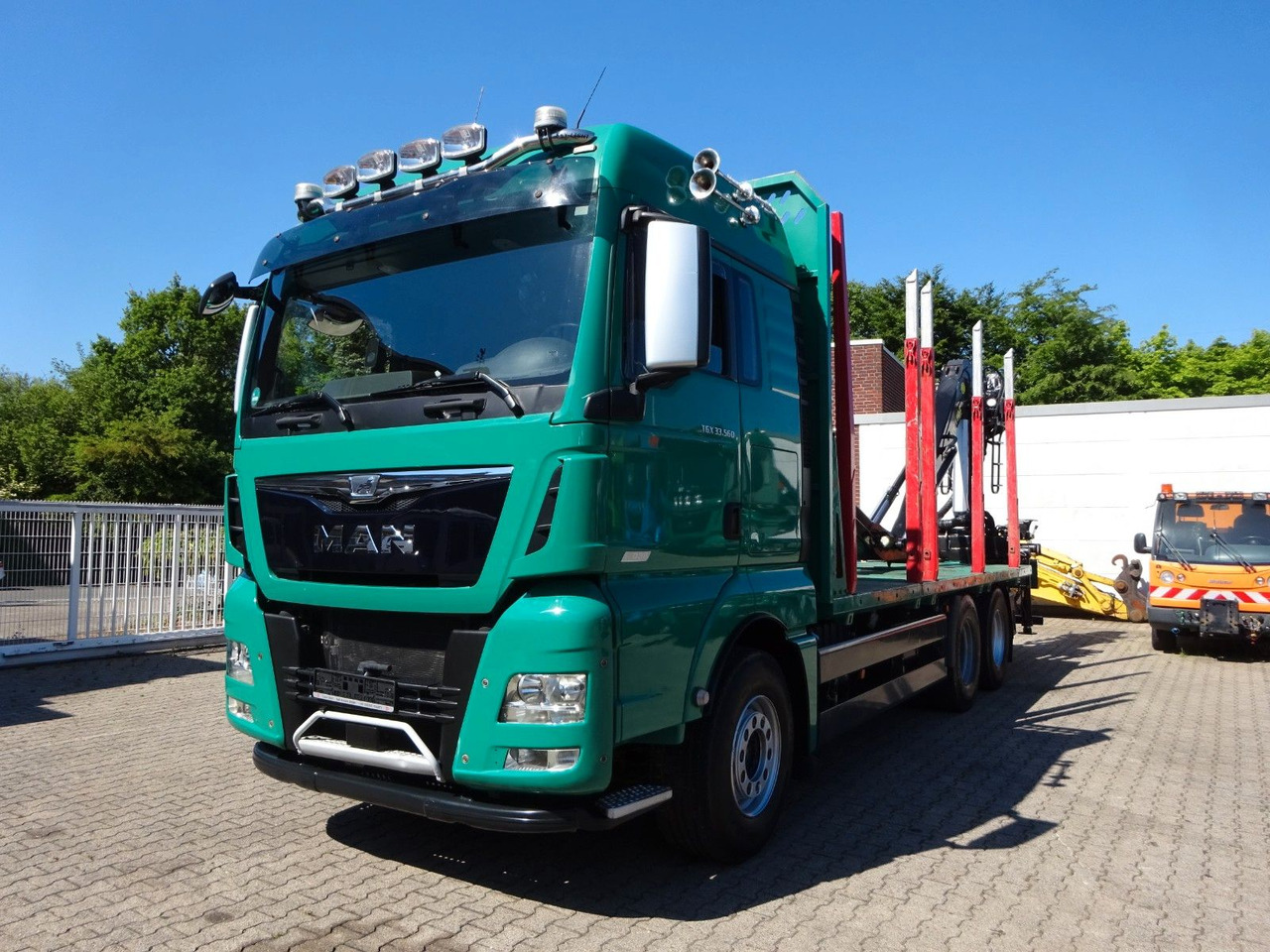 MAN 33.560 TGX mit TAJFUN L150Z Holzladekran 6x4 - شاحنة قطع الأشجار, شاحنة كرين: صورة 1 MAN 33.560 TGX mit TAJFUN L150Z Holzladekran 6x4 - شاحنة قطع الأشجار, شاحنة كرين: صورة 1