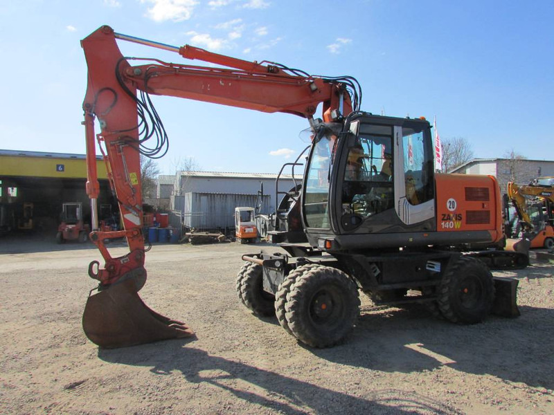 Hitachi ZX 140 W-3 Mobilbagger 45.000 EUR / Klima - حفارة دولاب: صورة 1 Hitachi ZX 140 W-3 Mobilbagger 45.000 EUR / Klima - حفارة دولاب: صورة 1