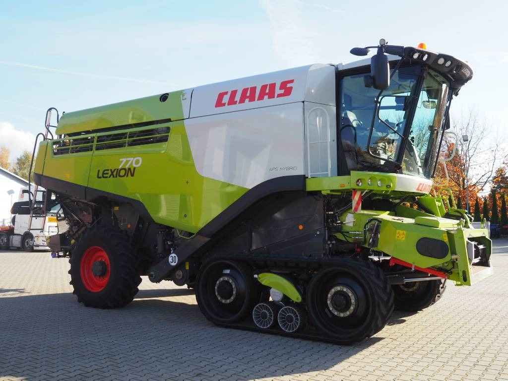 Claas Lexion 770TT 4x4 + V1200 - حصادة موحَّدة: صورة 4 Claas Lexion 770TT 4x4 + V1200 - حصادة موحَّدة: صورة 4