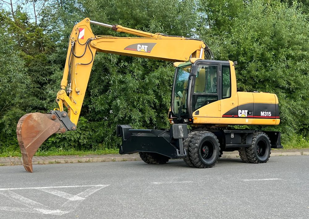 Caterpillar CAT M315C CATERPILLAR SPROWADZONY Bardzo Dobry Stan - حفارة دولاب: صورة 1 Caterpillar CAT M315C CATERPILLAR SPROWADZONY Bardzo Dobry Stan - حفارة دولاب: صورة 1