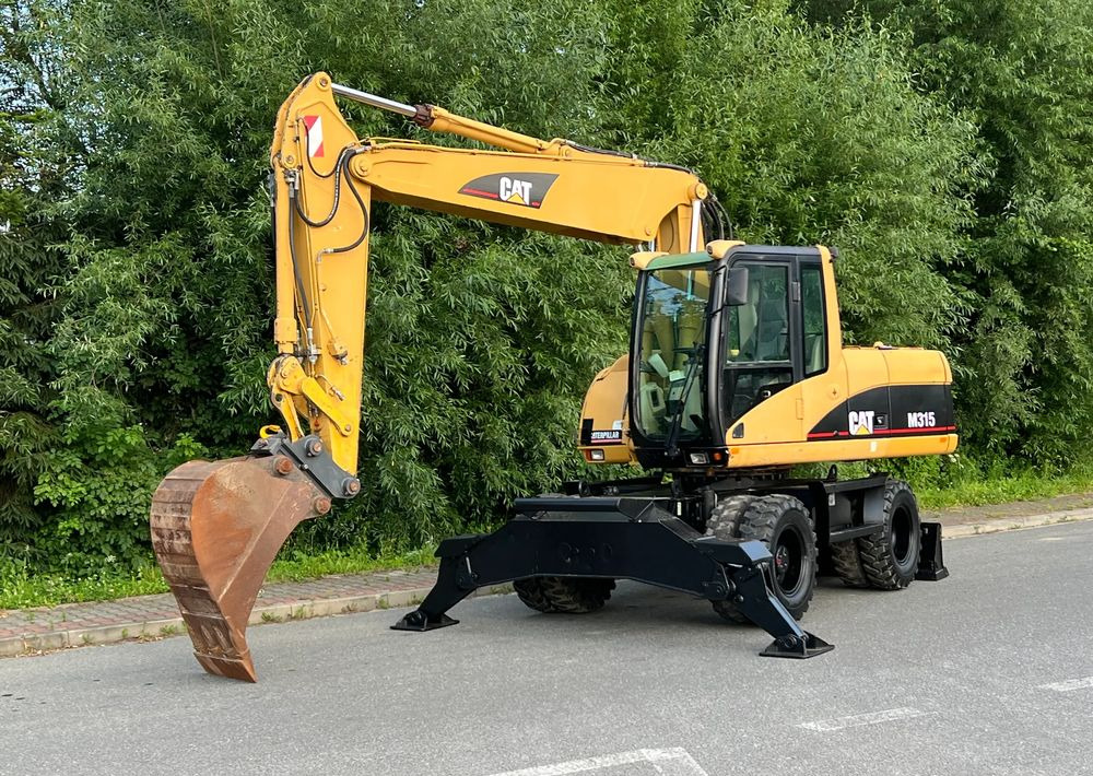 Caterpillar CAT M315C CATERPILLAR SPROWADZONY Bardzo Dobry Stan - حفارة دولاب: صورة 1 Caterpillar CAT M315C CATERPILLAR SPROWADZONY Bardzo Dobry Stan - حفارة دولاب: صورة 1