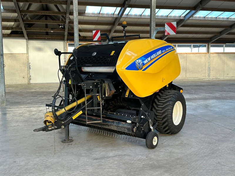 New Holland Roll baler 125 - حصادة: صورة 1 New Holland Roll baler 125 - حصادة: صورة 1