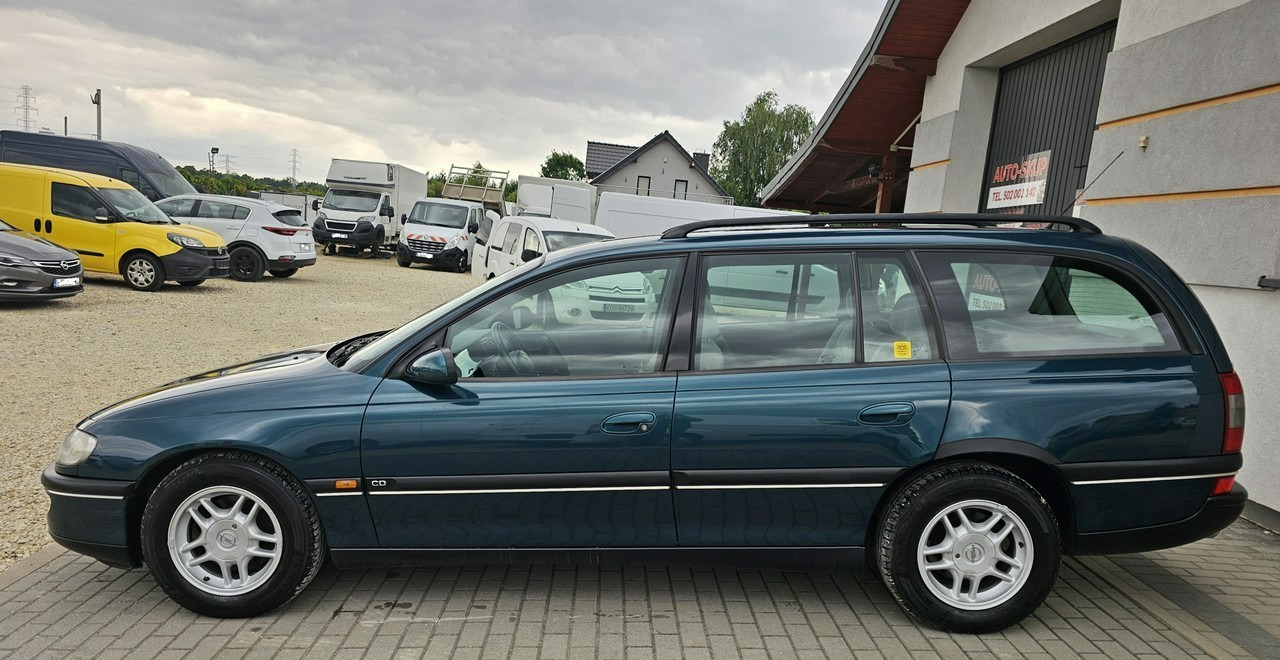 Opel Omega B 2,5 v6 *automat* napęd tył *welury* - سيارة ستيشن: صورة 4 Opel Omega B 2,5 v6 *automat* napęd tył *welury* - سيارة ستيشن: صورة 4