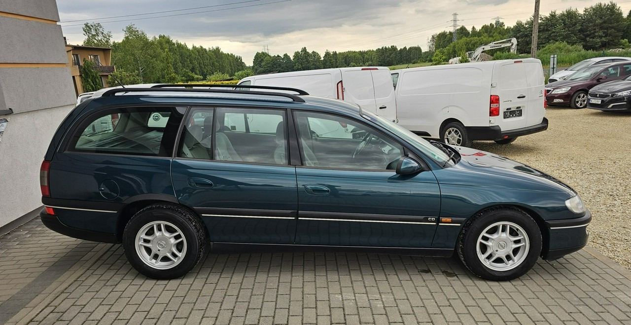 Opel Omega B 2,5 v6 *automat* napęd tył *welury* - سيارة ستيشن: صورة 5 Opel Omega B 2,5 v6 *automat* napęd tył *welury* - سيارة ستيشن: صورة 5