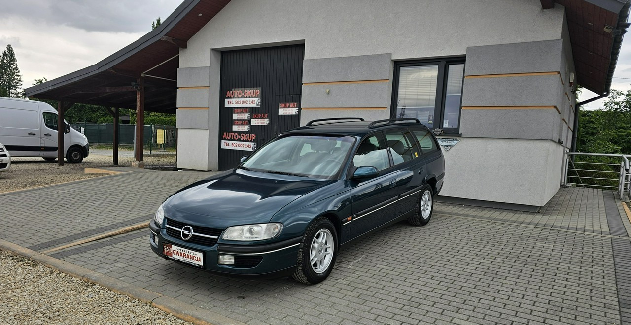 Opel Omega B 2,5 v6 *automat* napęd tył *welury* - سيارة ستيشن: صورة 3 Opel Omega B 2,5 v6 *automat* napęd tył *welury* - سيارة ستيشن: صورة 3