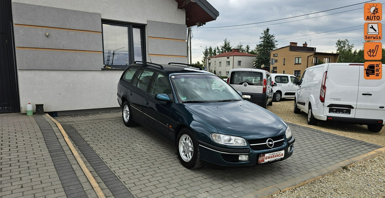 Opel Omega B 2,5 v6 *automat* napęd tył *welury* - سيارة ستيشن: صورة 1 Opel Omega B 2,5 v6 *automat* napęd tył *welury* - سيارة ستيشن: صورة 1