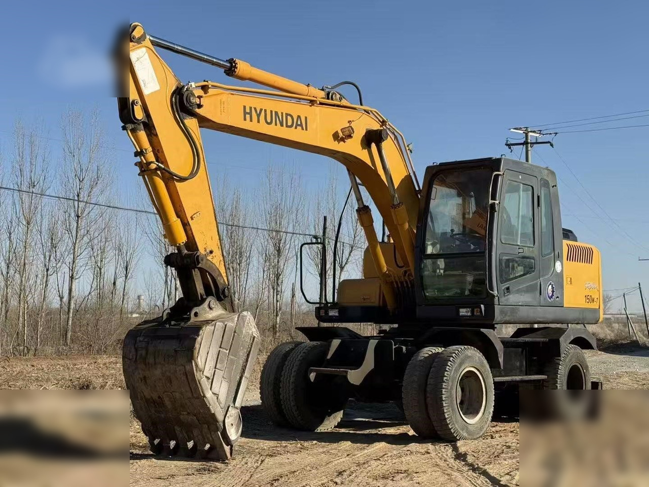 HYUNDAI ROBEX 150W-7A - حفارة دولاب: صورة 3 HYUNDAI ROBEX 150W-7A - حفارة دولاب: صورة 3