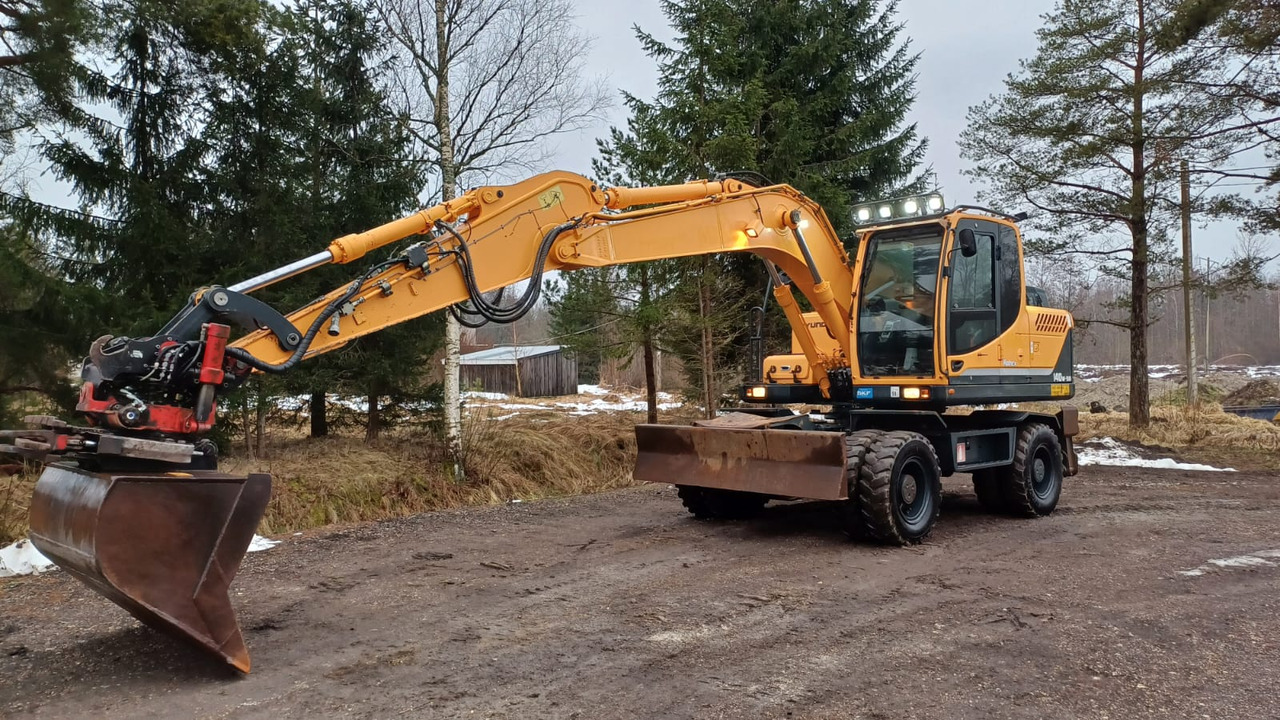 Hyundai Robex 140W-9A - حفارة دولاب: صورة 1 Hyundai Robex 140W-9A - حفارة دولاب: صورة 1