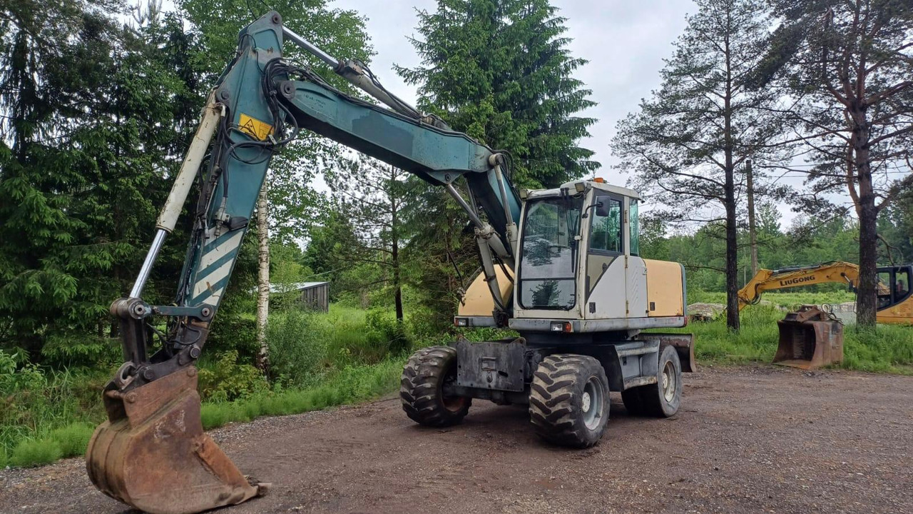 Volvo EW140 - حفارة دولاب: صورة 1 Volvo EW140 - حفارة دولاب: صورة 1