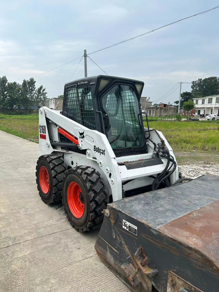 BOBCAT S160 - شيول صغير: صورة 1 BOBCAT S160 - شيول صغير: صورة 1