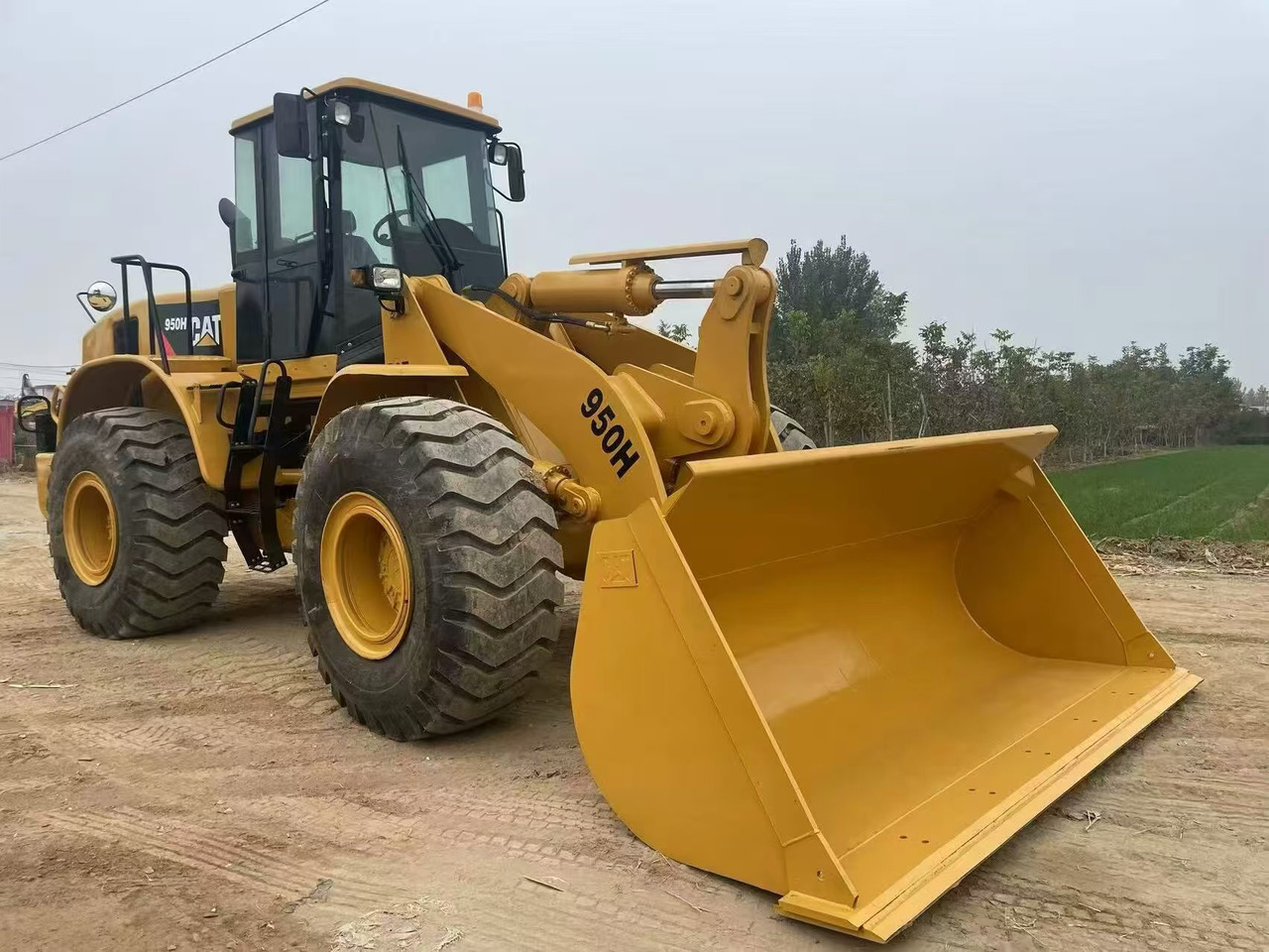 اللودر بعجل CATERPILLAR 950H: صورة 9