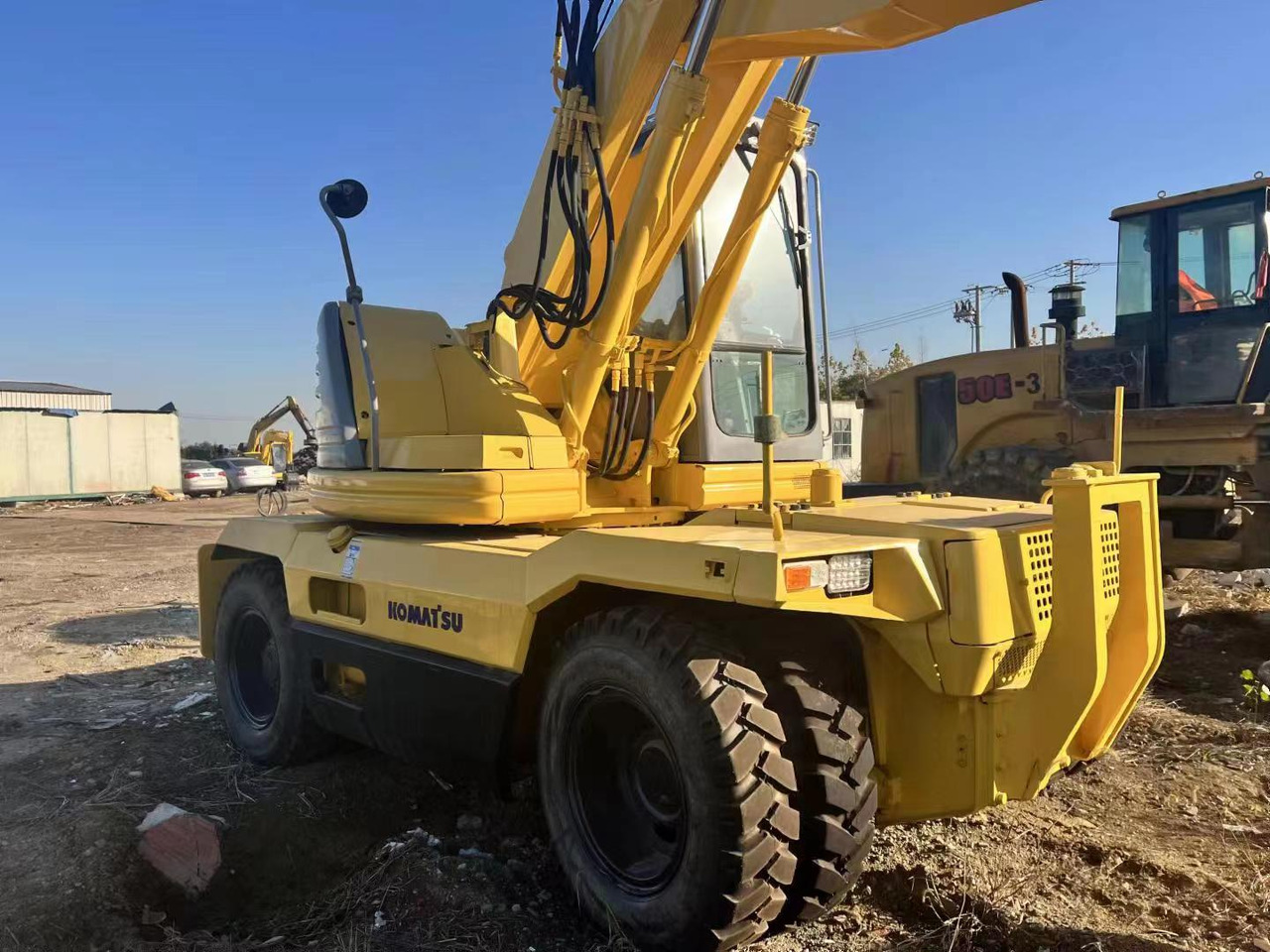 KOMATSU PC128US - حفارة دولاب: صورة 3 KOMATSU PC128US - حفارة دولاب: صورة 3
