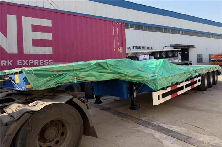 TITAN 3 Axle 80 Ton Low Bed Trailer Price for Sale In Nigeria - عربة منخفضة مسطحة نصف مقطورة: صورة 4 TITAN 3 Axle 80 Ton Low Bed Trailer Price for Sale In Nigeria - عربة منخفضة مسطحة نصف مقطورة: صورة 4