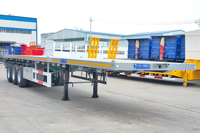 TITAN Tri Axle 40Ft Flatbed Trailer Price for Sale in Sierra Leone - نصف مقطورة مسطحة: صورة 1 TITAN Tri Axle 40Ft Flatbed Trailer Price for Sale in Sierra Leone - نصف مقطورة مسطحة: صورة 1