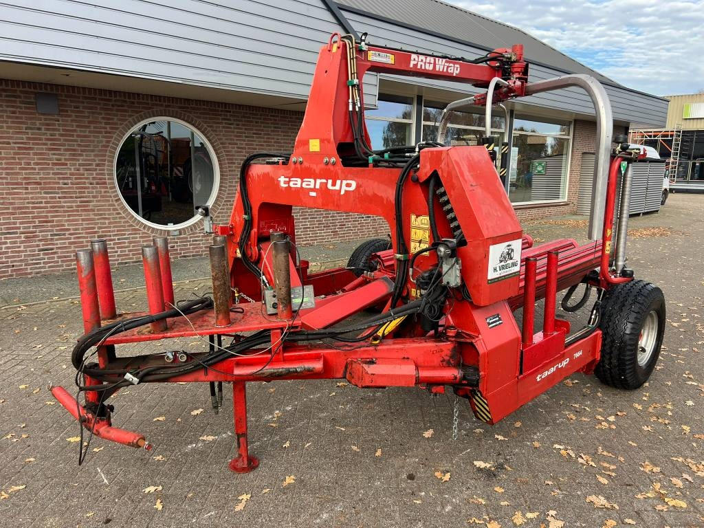 Kverneland Taarup 7664 - آلة تغليف بالة التبن: صورة 1 Kverneland Taarup 7664 - آلة تغليف بالة التبن: صورة 1