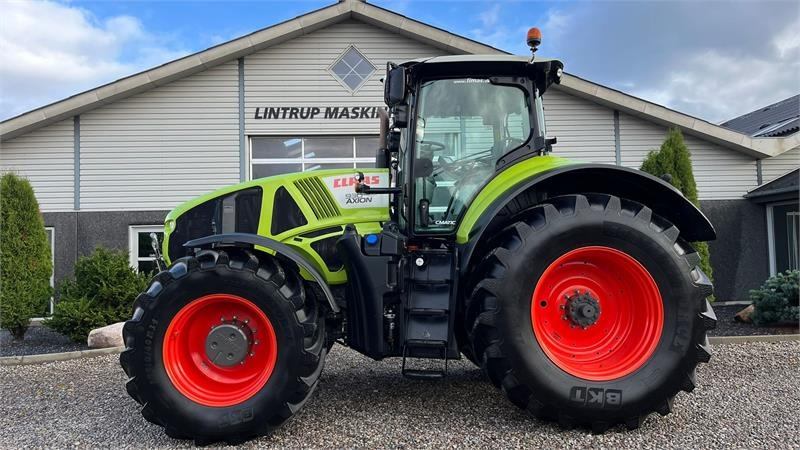 Claas Axion 930 CMatic Med næsten nye dæk, frontlift og - جرار: صورة 1 Claas Axion 930 CMatic Med næsten nye dæk, frontlift og - جرار: صورة 1