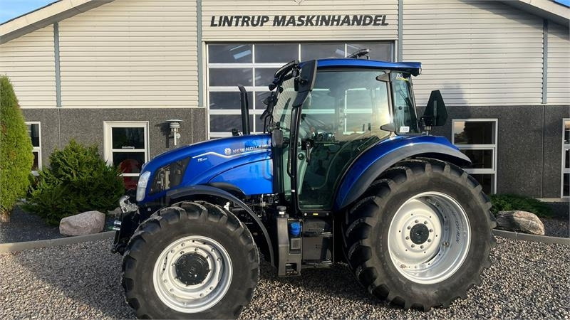 New Holland T5.100 Blue Power udstyrs model, med brede hjul, f - جرار: صورة 1 New Holland T5.100 Blue Power udstyrs model, med brede hjul, f - جرار: صورة 1