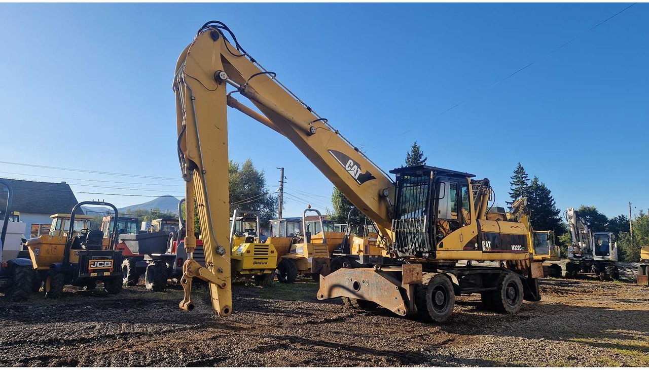 Caterpillar M322C - حفارة دولاب: صورة 1 Caterpillar M322C - حفارة دولاب: صورة 1