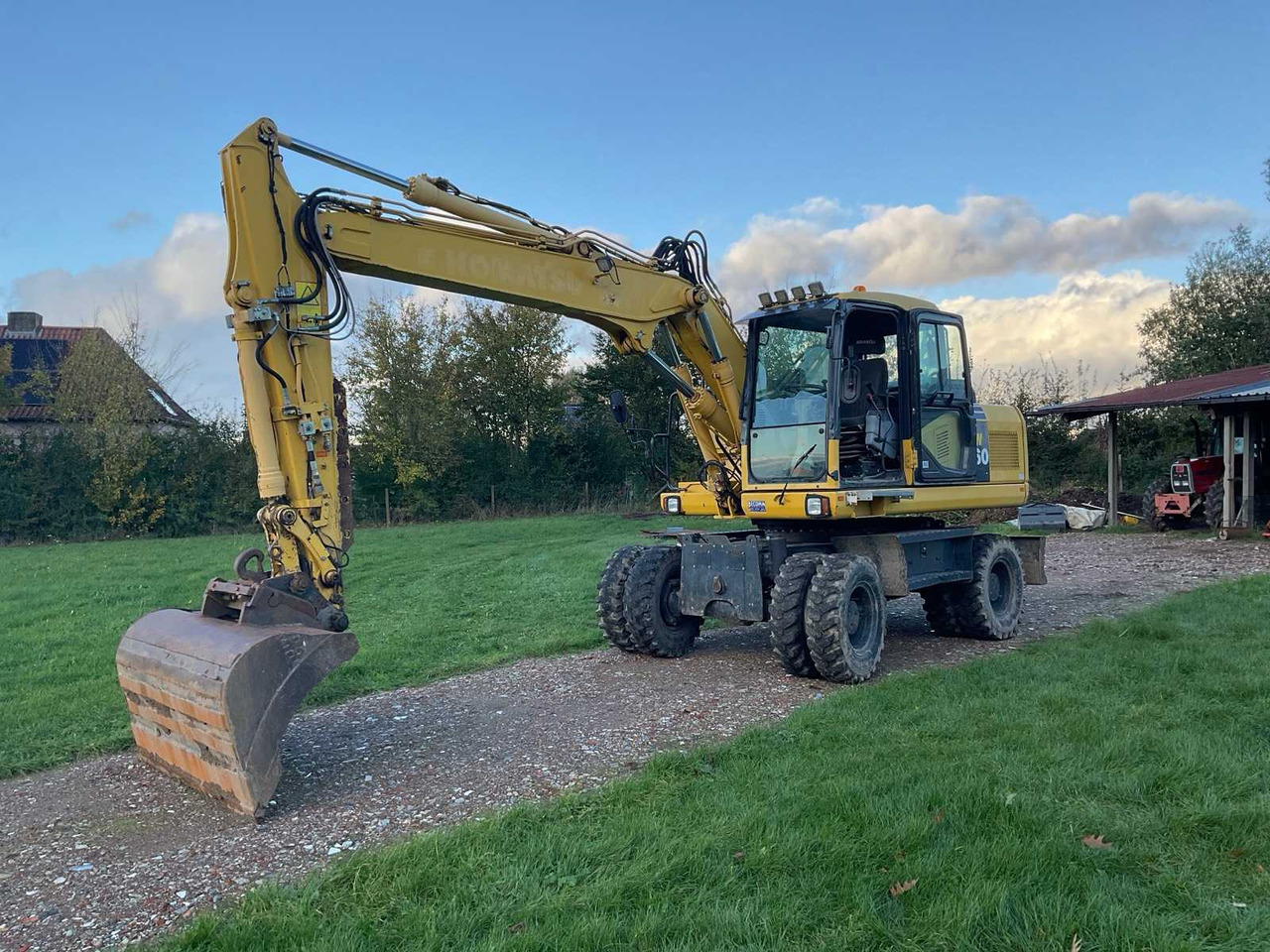 Komatsu PW160-7EO - حفارة دولاب: صورة 1 Komatsu PW160-7EO - حفارة دولاب: صورة 1