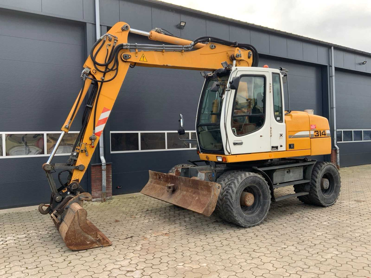 Liebherr A314 Litronic - حفارة دولاب: صورة 1 Liebherr A314 Litronic - حفارة دولاب: صورة 1