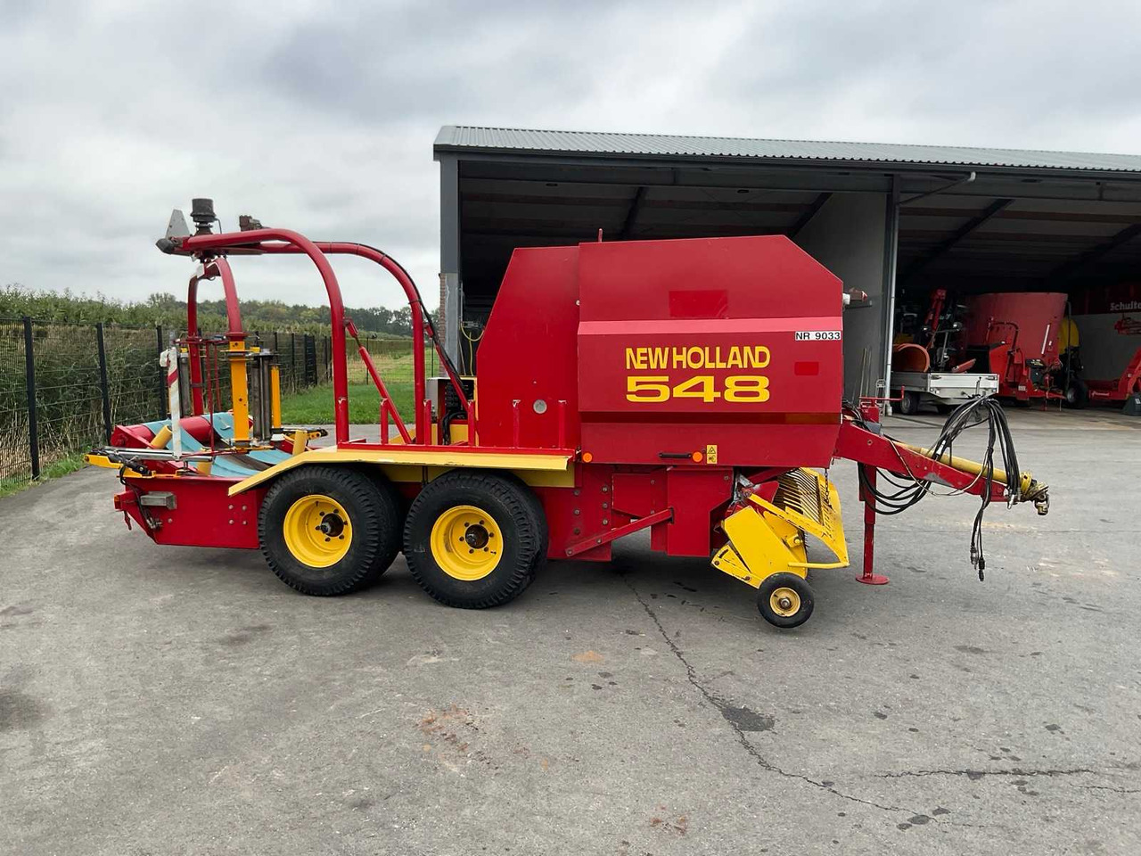 New Holland 548 - مكنة, آلة تغليف بالة التبن: صورة 4 New Holland 548 - مكنة, آلة تغليف بالة التبن: صورة 4