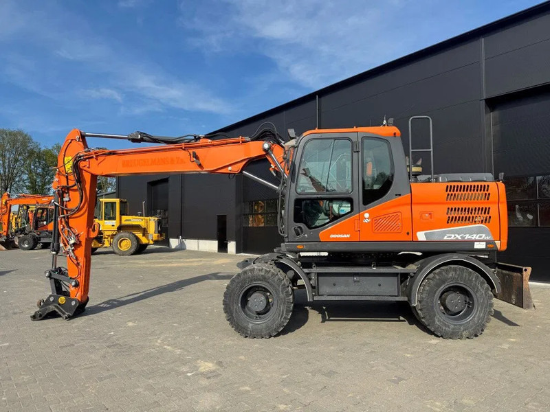 Doosan DX140-5 2018 - حفارة دولاب: صورة 1 Doosan DX140-5 2018 - حفارة دولاب: صورة 1