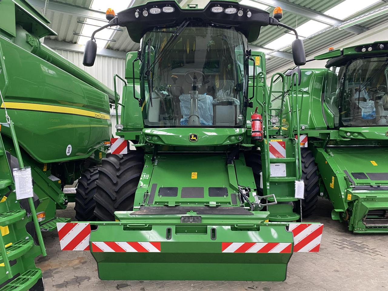 John Deere T550i - حصادة موحَّدة: صورة 1 John Deere T550i - حصادة موحَّدة: صورة 1